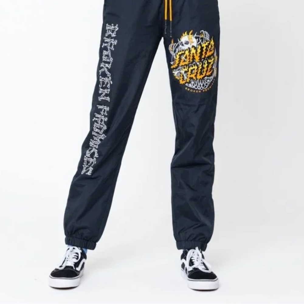 Large broken promises wind breaker pants